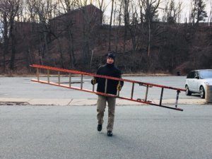 Sheriff's Sergeant Walter Rawa managed to dislodge a faded red ladder that was partially embedded in the muddy bottom of the Whippany River in Morristown