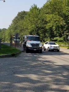 County road crew sweeps street on Lakeside Boulevard in Roxbury near the Hopatcong State Park entrance