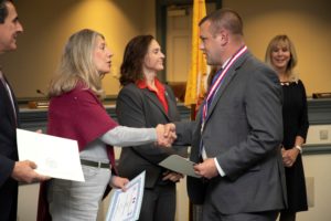Veteran Todd Stawicki of Roxbury shakes hands with Freeholder Deborah Smith