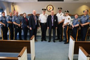 Morris County Sheriff stands with CALEA team and his staff