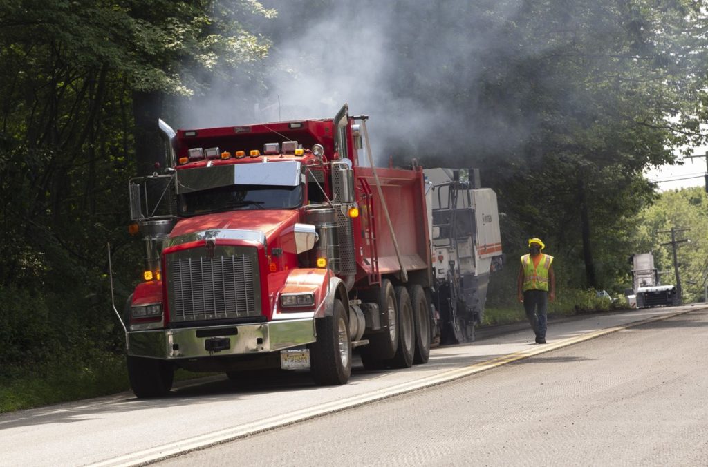photo shows paving trucks on section of Berkshire Valley Road