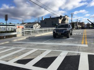 SUV driving over the reopened East Blackwell Street bridge