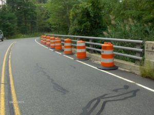 Top deck of Russia Road bridge, showing warning barrels