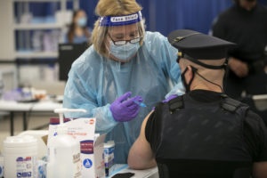 Sgt. Michael Zarro, of the Mount Olive Police is given a vaccine.
