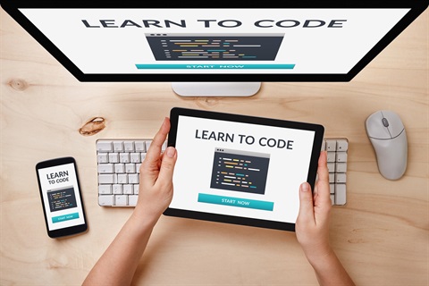 IT Devices with Hour of Code logo